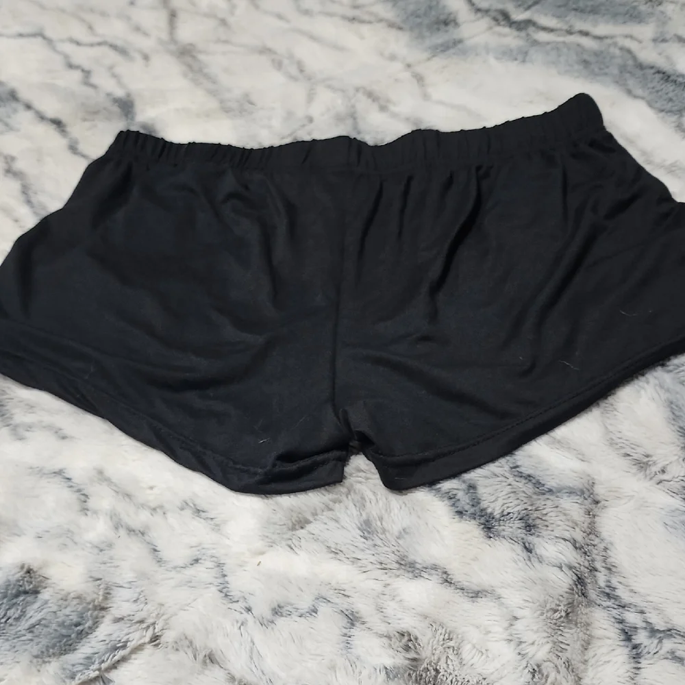 Care Bears Black Shorts with Orange and Purple Print